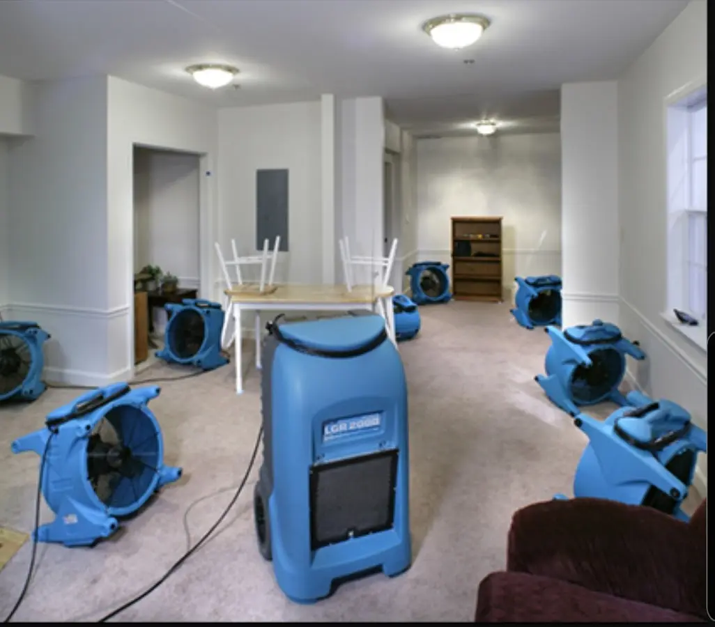 Air movers and dehumidifier setup for Water Damage Restoration in Barnhart